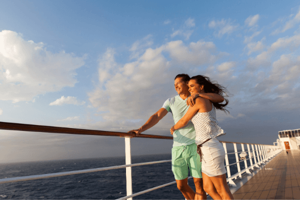 Couple standing on cruise desk not getting sick