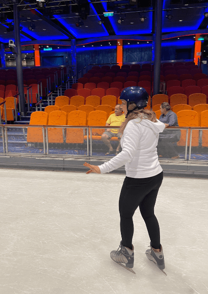 Ice skating on Oasis of the Seas wearing sweatshirt and yoga pants