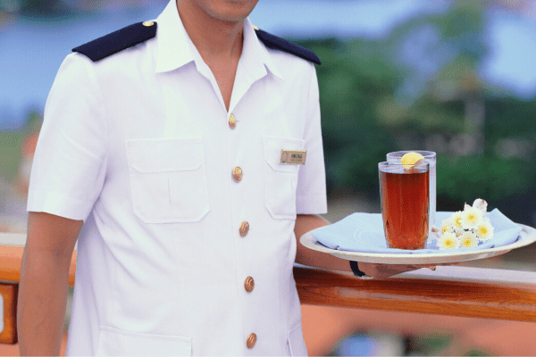 crew on cruise serving drink