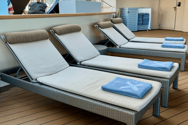 Celebrity cruise towels placed on deck chairs