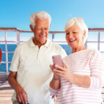 couple using cell phone on cruise ship