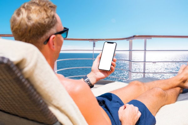 man on phone on cruise ship